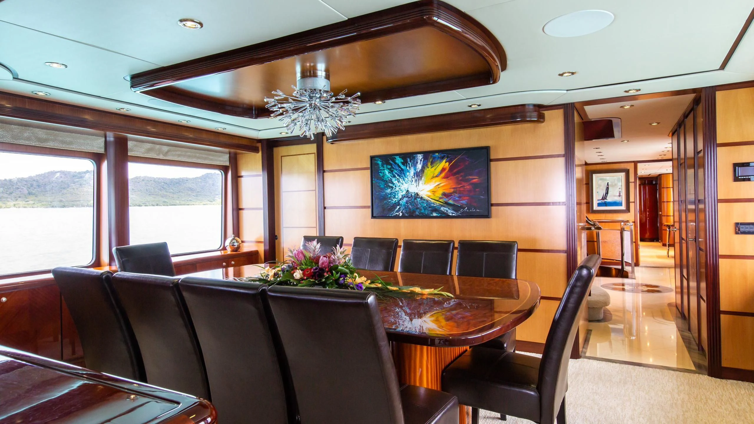 a room with a table and chairs aboard JUST ENOUGH Yacht for Charter