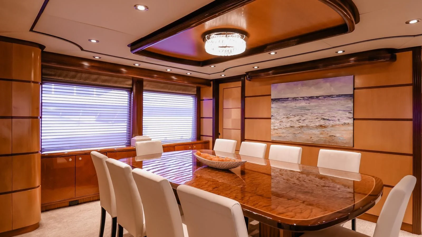 a room with tables and chairs aboard JUST ENOUGH Yacht for Charter