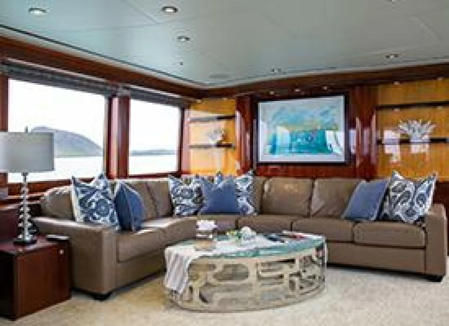 a living room with a large sofa aboard JUST ENOUGH Yacht for Charter