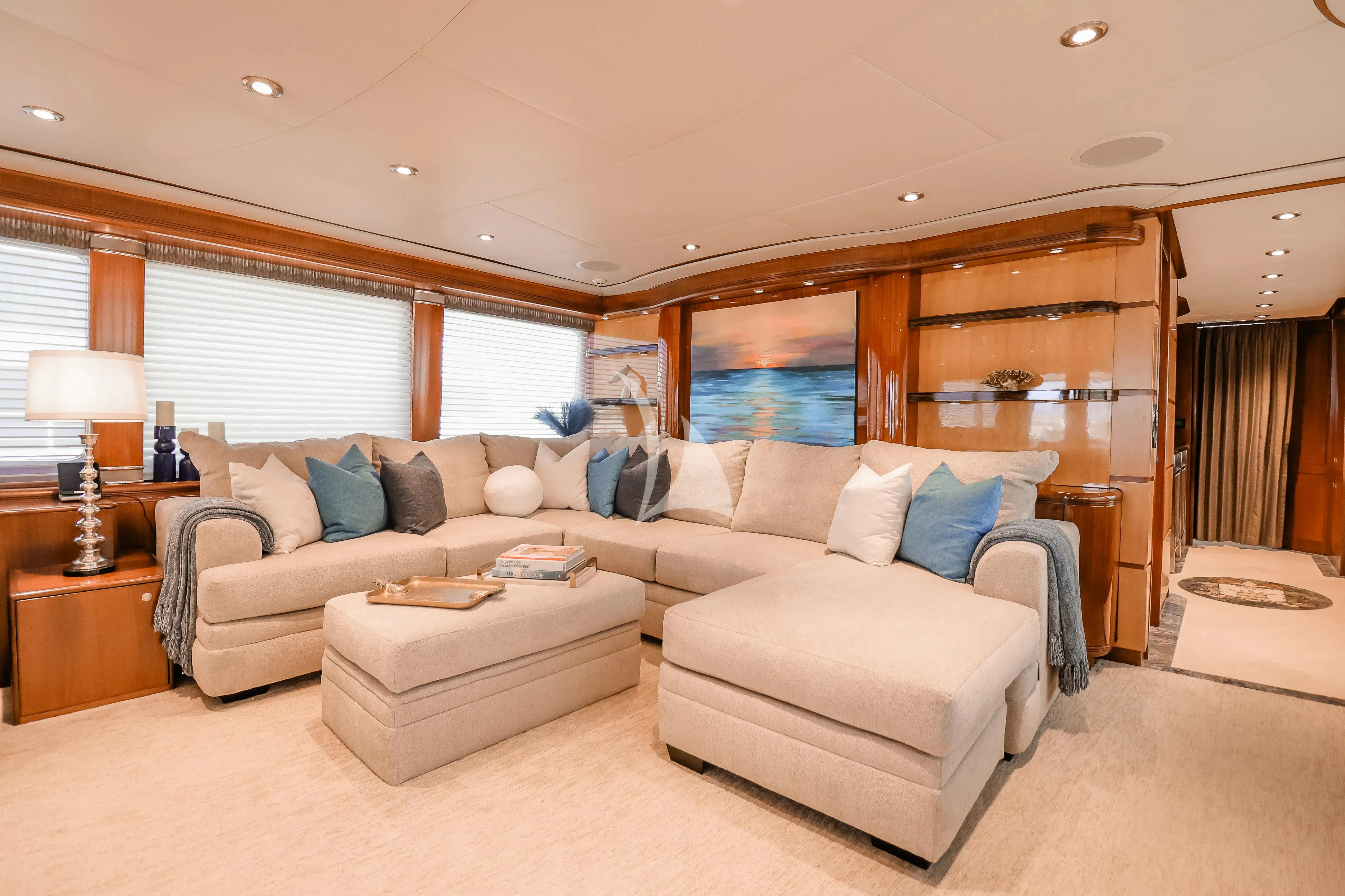 a living room with a couch and a table aboard JUST ENOUGH Yacht for Charter