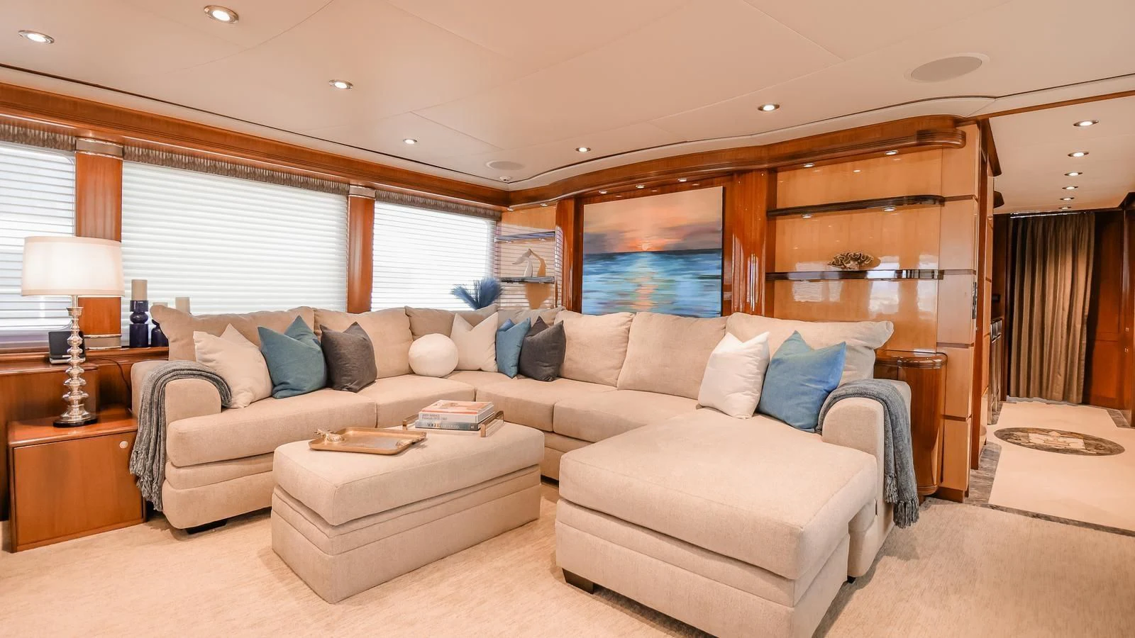 a living room with a couch and a table aboard JUST ENOUGH Yacht for Charter