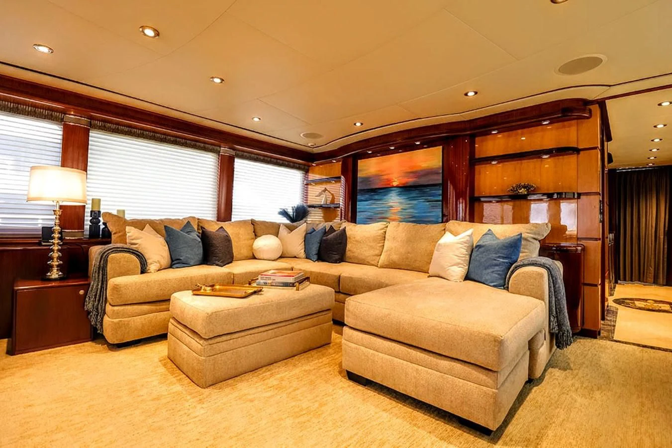 a living room with a couch and a table aboard JUST ENOUGH Yacht for Charter