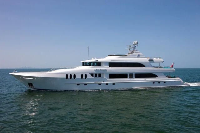 a white boat in the water aboard JUST ENOUGH Yacht for Charter