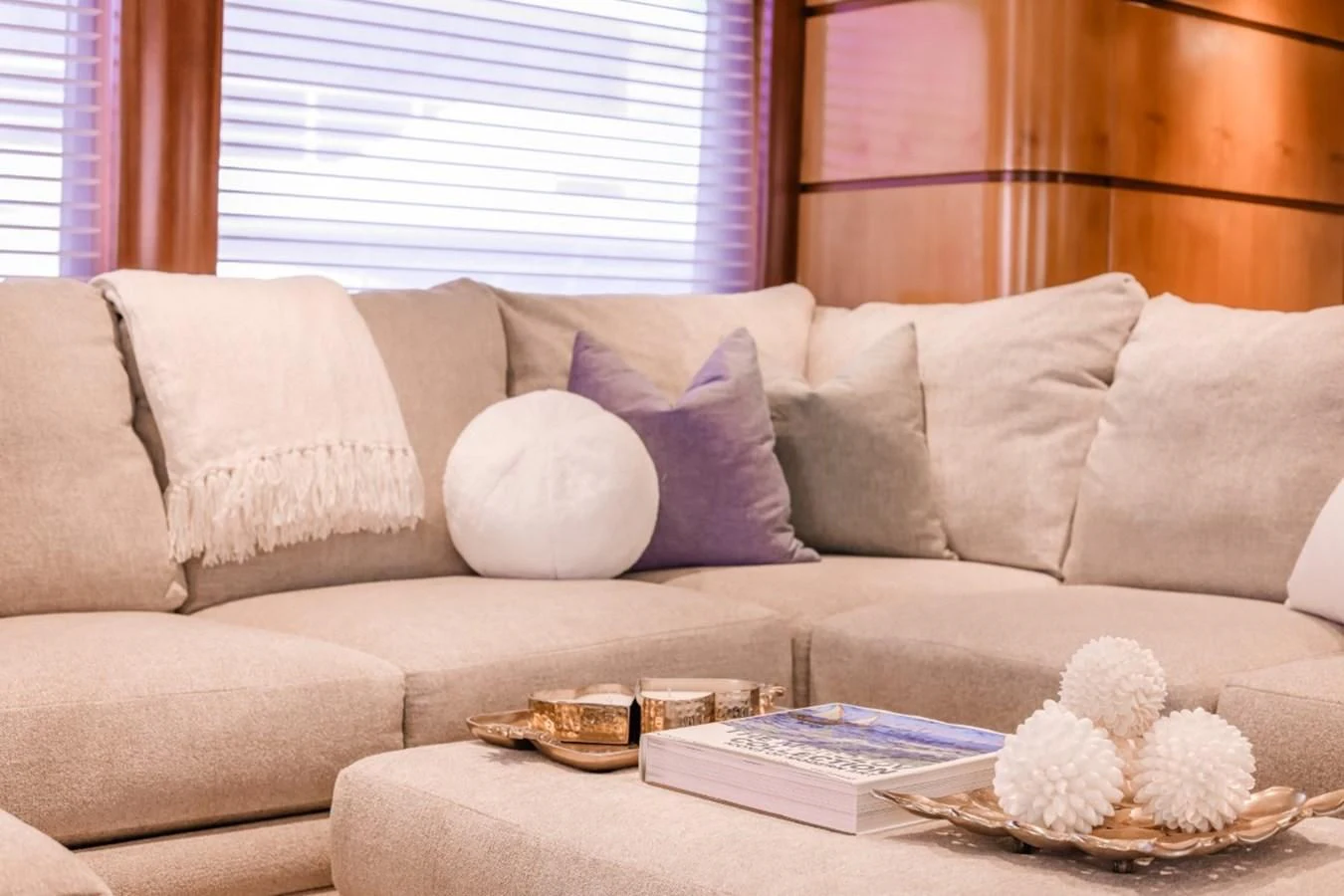 a couch with a tray of food on it aboard JUST ENOUGH Yacht for Charter