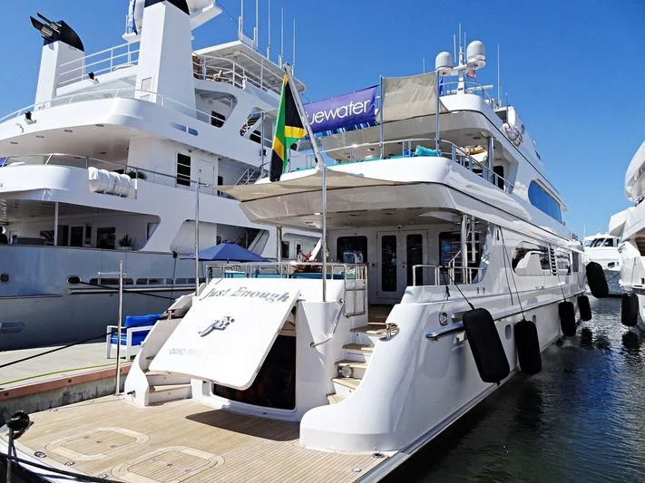 a boat docked at a pier aboard JUST ENOUGH Yacht for Charter