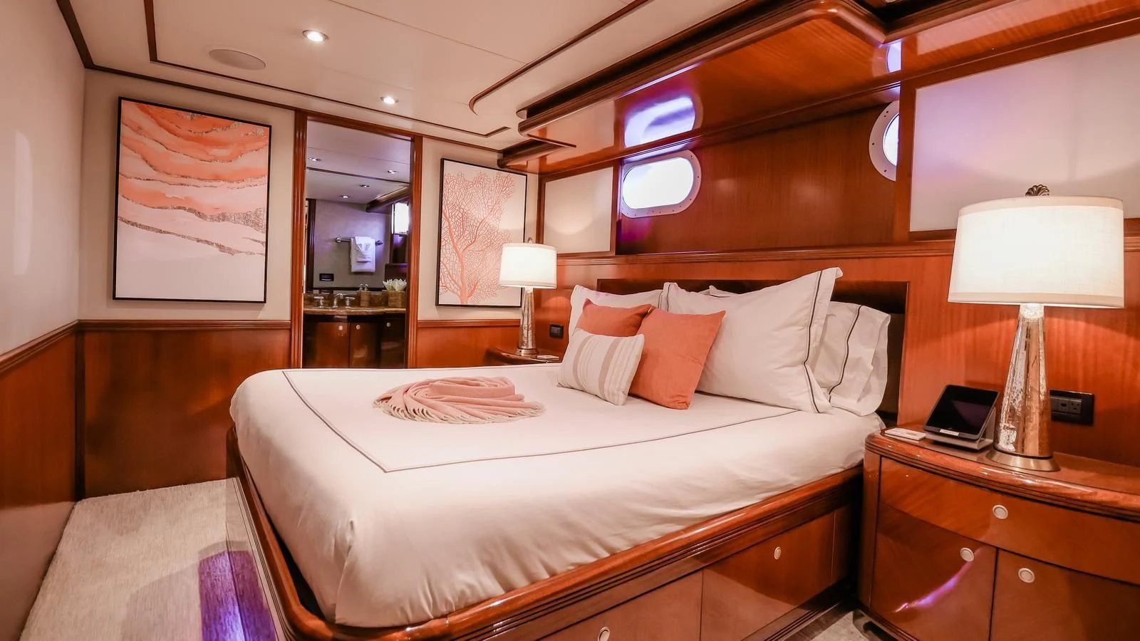 a hotel room with a bed and a desk aboard JUST ENOUGH Yacht for Charter