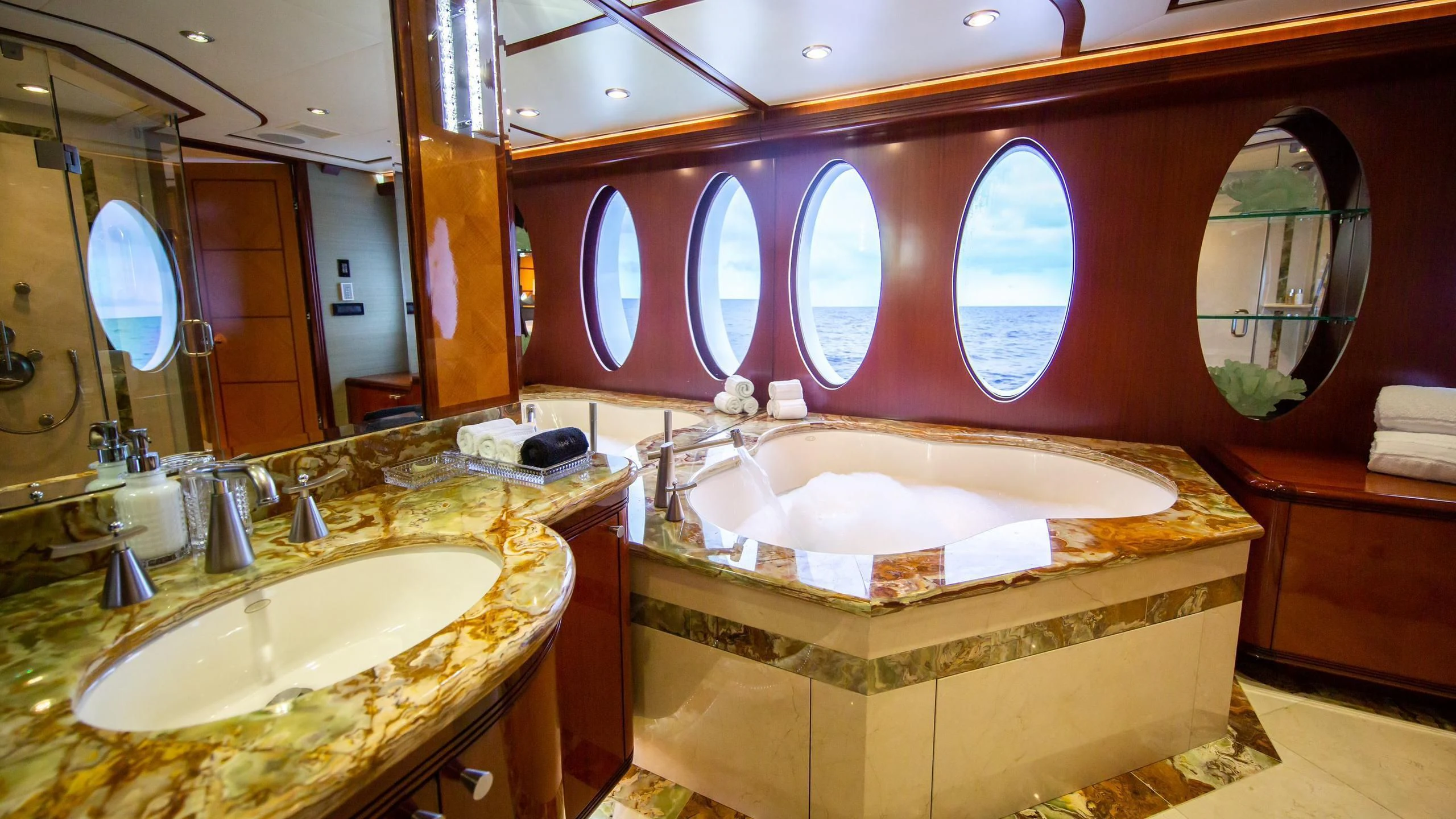 a bathroom with a large mirror aboard JUST ENOUGH Yacht for Charter