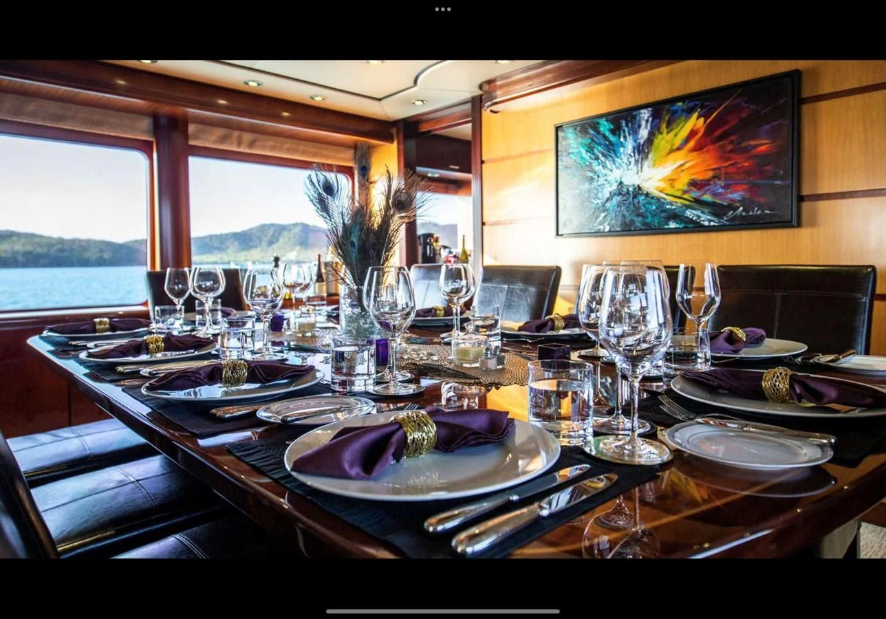a table set with place settings aboard JUST ENOUGH Yacht for Charter