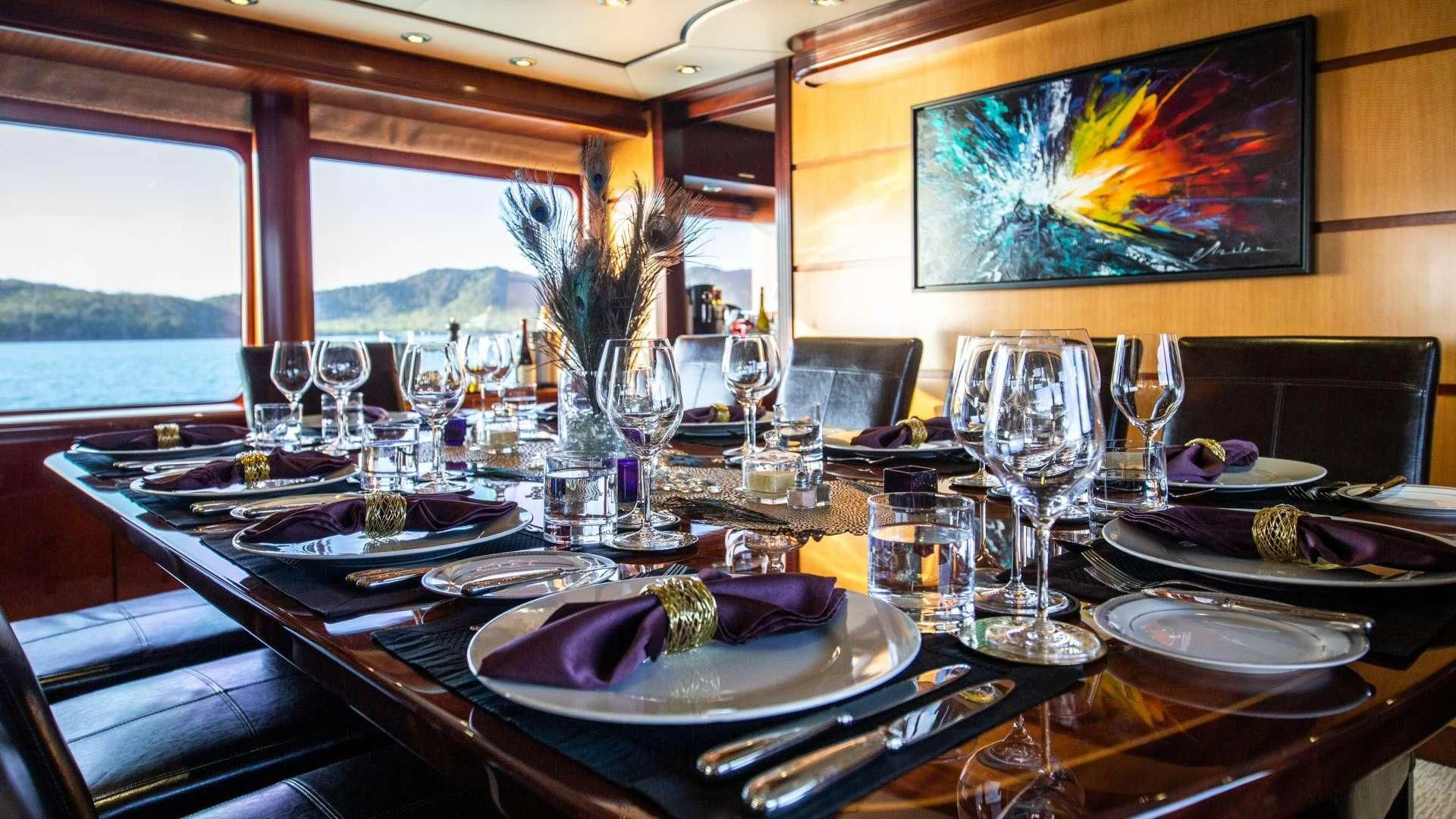 a table set with place settings aboard JUST ENOUGH Yacht for Charter