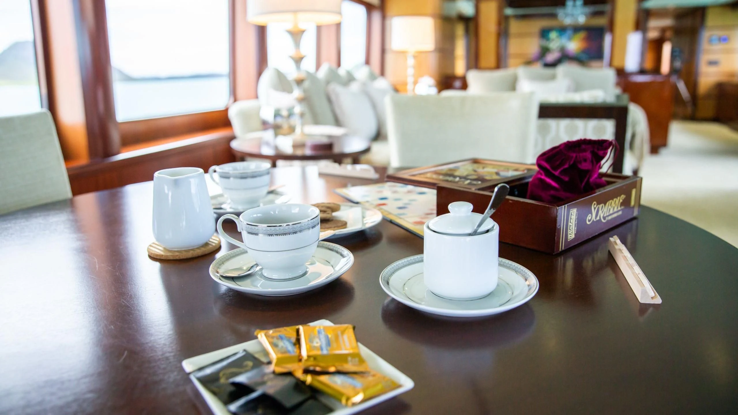 a table with plates and cups on it aboard JUST ENOUGH Yacht for Charter
