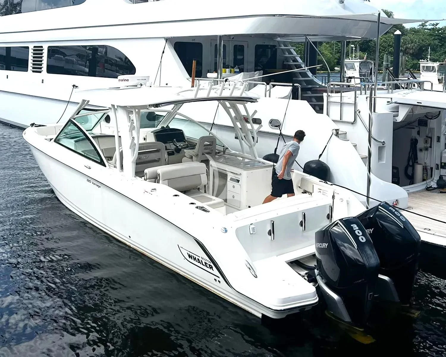 a person standing on a boat aboard JUST ENOUGH Yacht for Charter