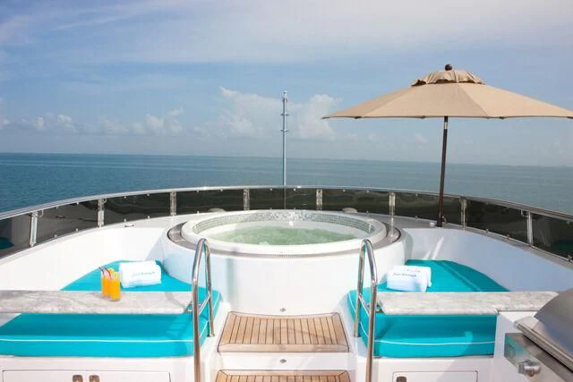 a pool with chairs and umbrellas aboard JUST ENOUGH Yacht for Charter