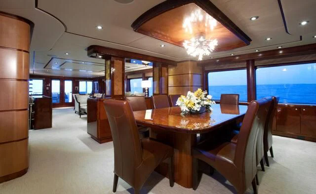 a large conference room with a table and chairs aboard JUST ENOUGH Yacht for Charter