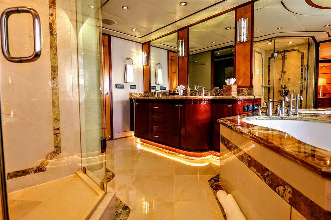 a bathroom with a countertop sink and mirrors aboard JUST ENOUGH Yacht for Charter