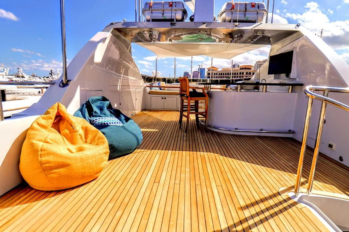 a deck with a large cruise ship aboard JUST ENOUGH Yacht for Charter