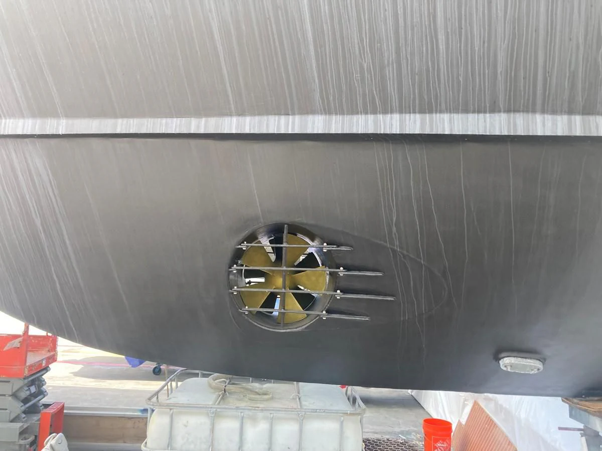 a large metal object with a round yellow object on it aboard JUST ENOUGH Yacht for Charter