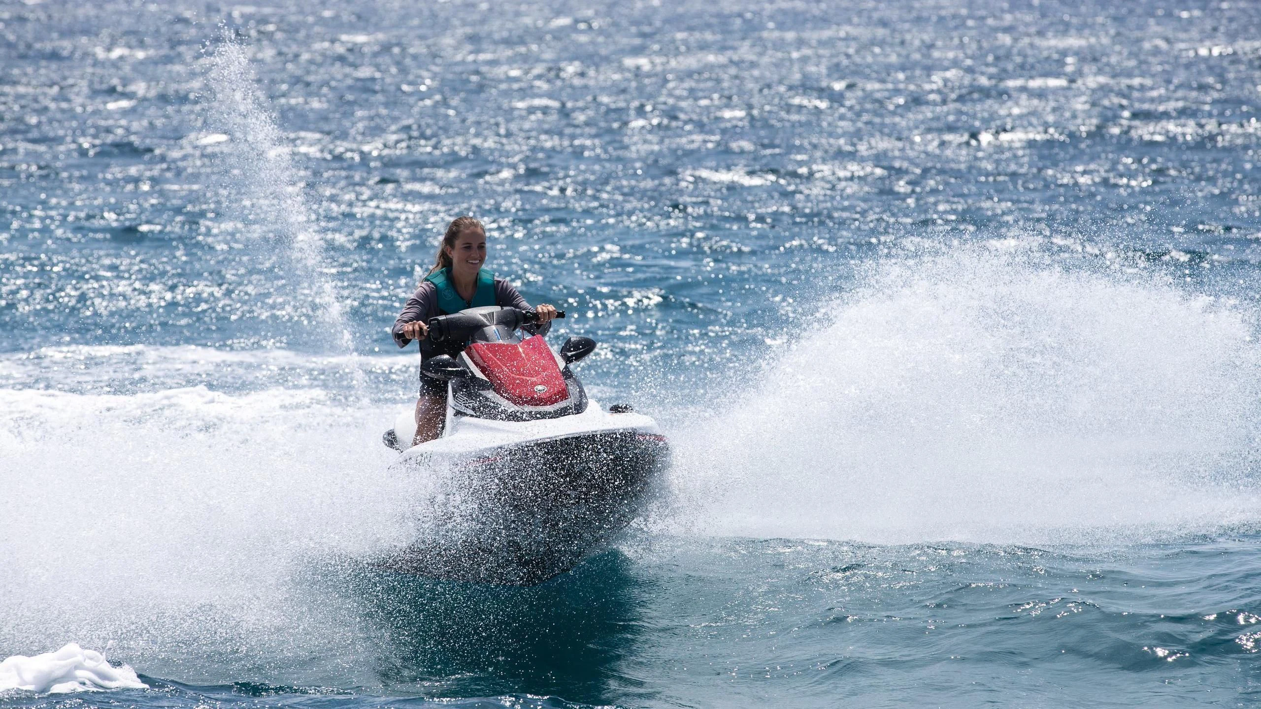 a person riding a jet ski aboard JUST ENOUGH Yacht for Charter