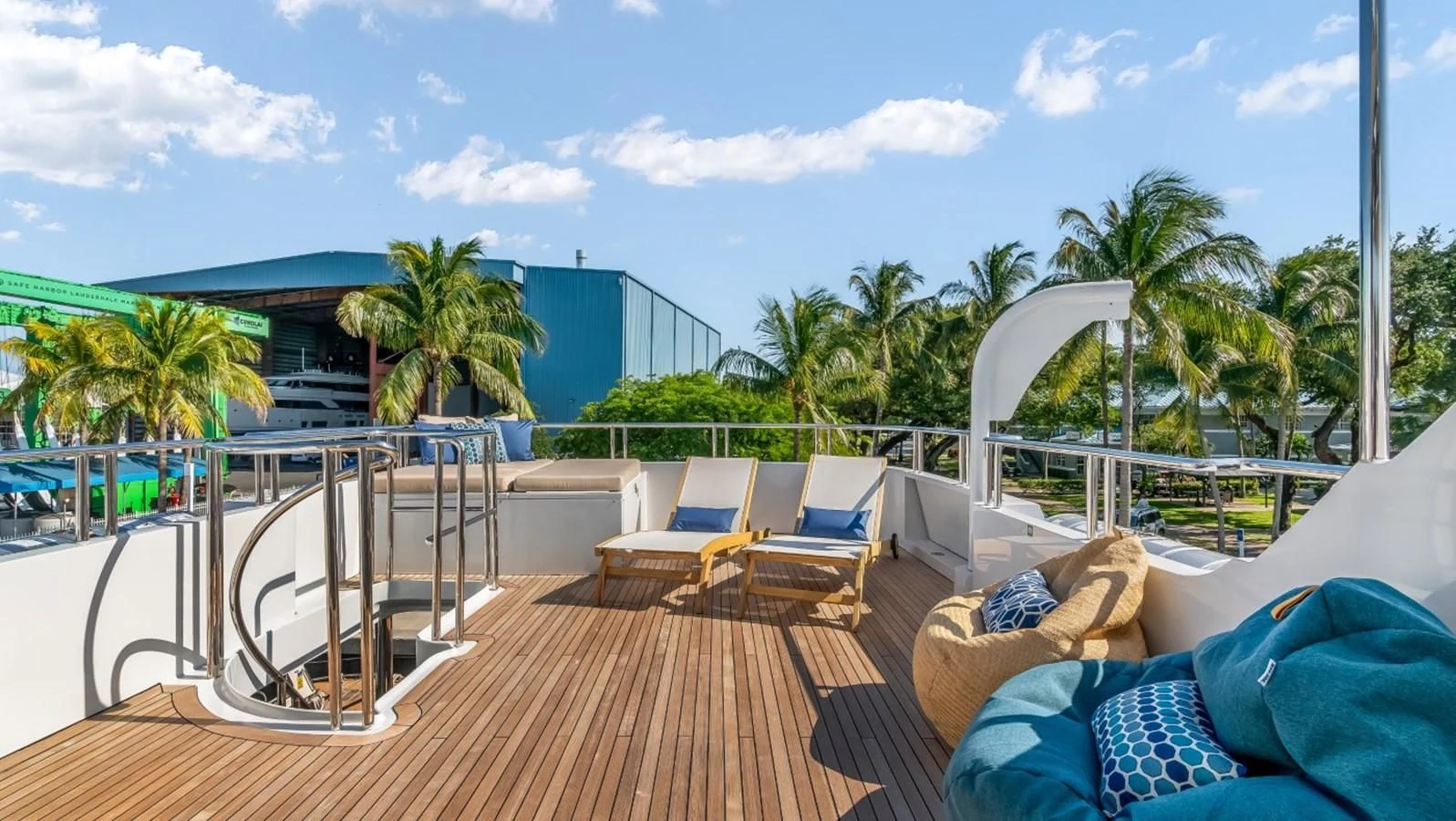 a deck with chairs and a pool aboard JUST ENOUGH Yacht for Charter