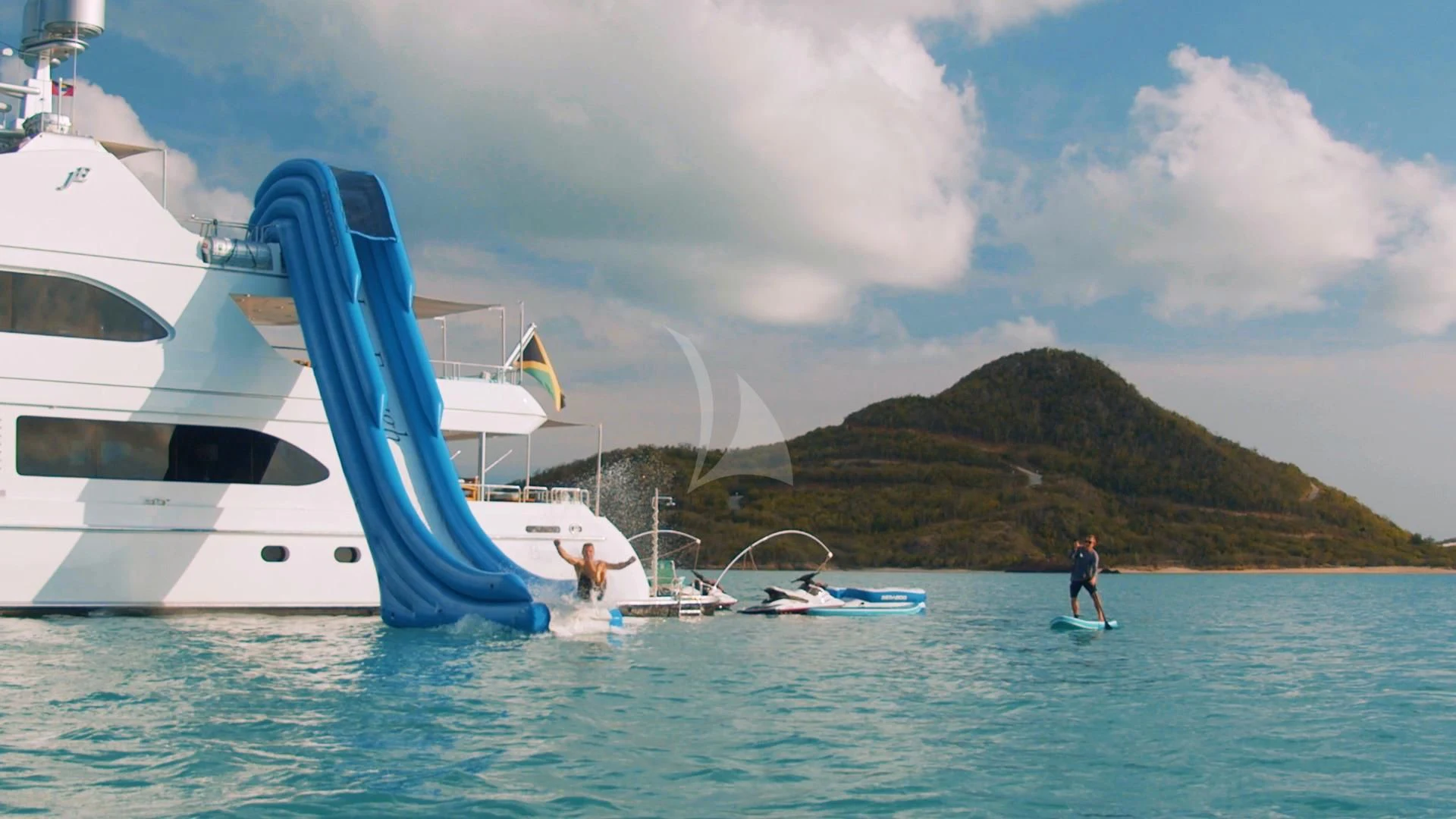 a couple of people on a sailboat in the water aboard JUST ENOUGH Yacht for Charter