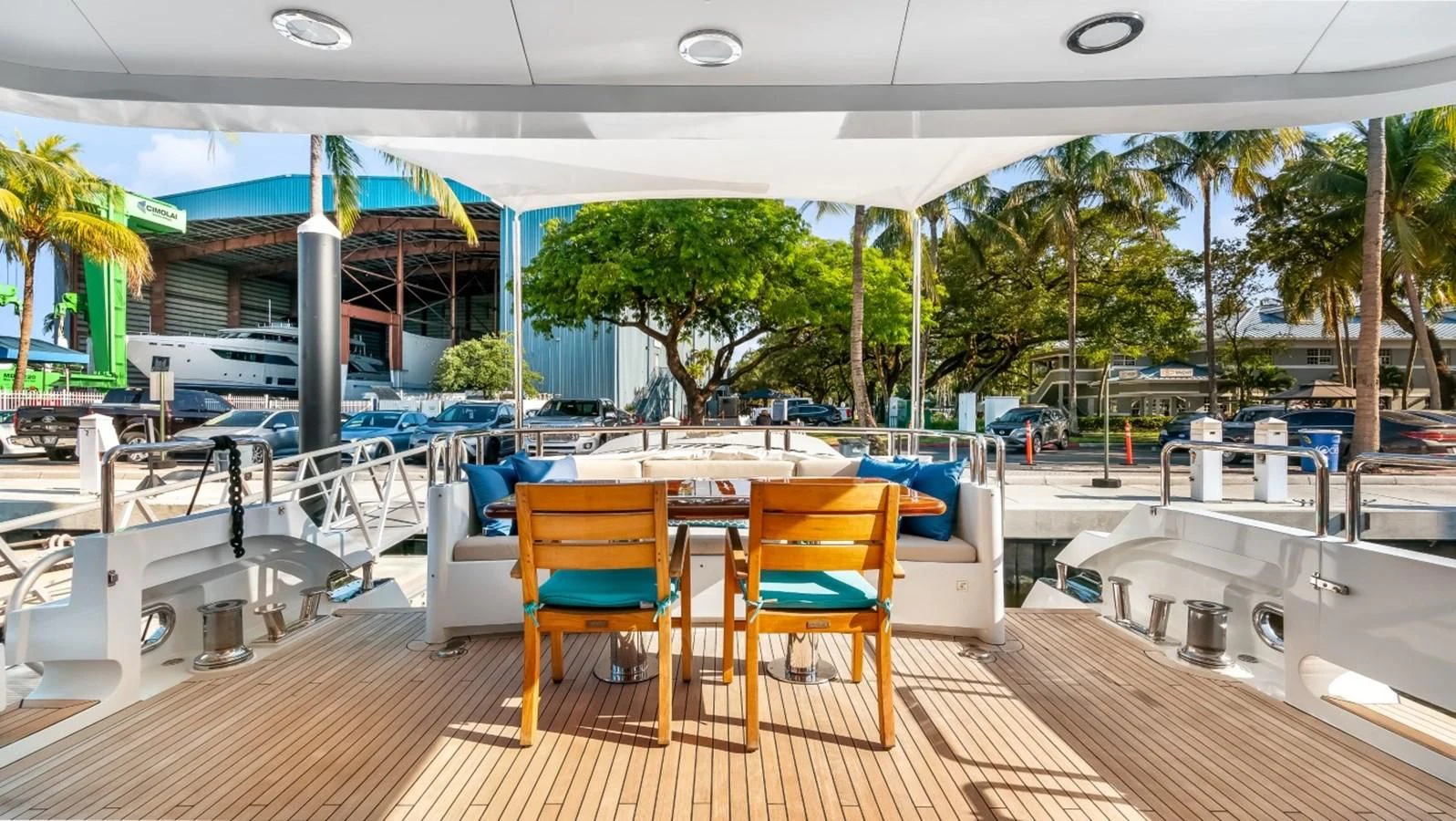 a patio with tables and chairs aboard JUST ENOUGH Yacht for Charter