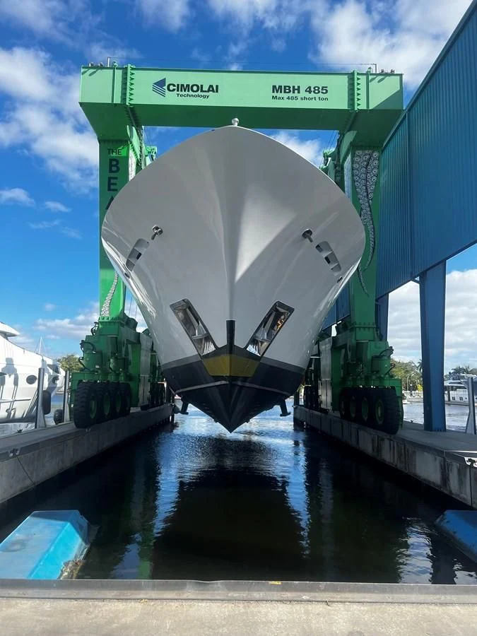 a large container ship aboard JUST ENOUGH Yacht for Charter