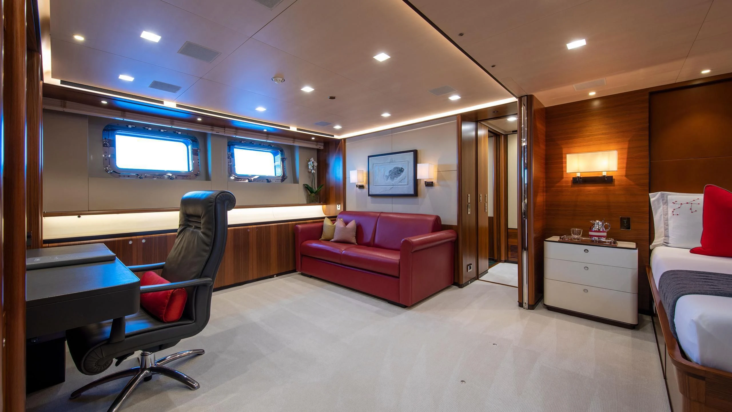 a room with a bed and a chair aboard PERSEUS^3 Yacht for Sale