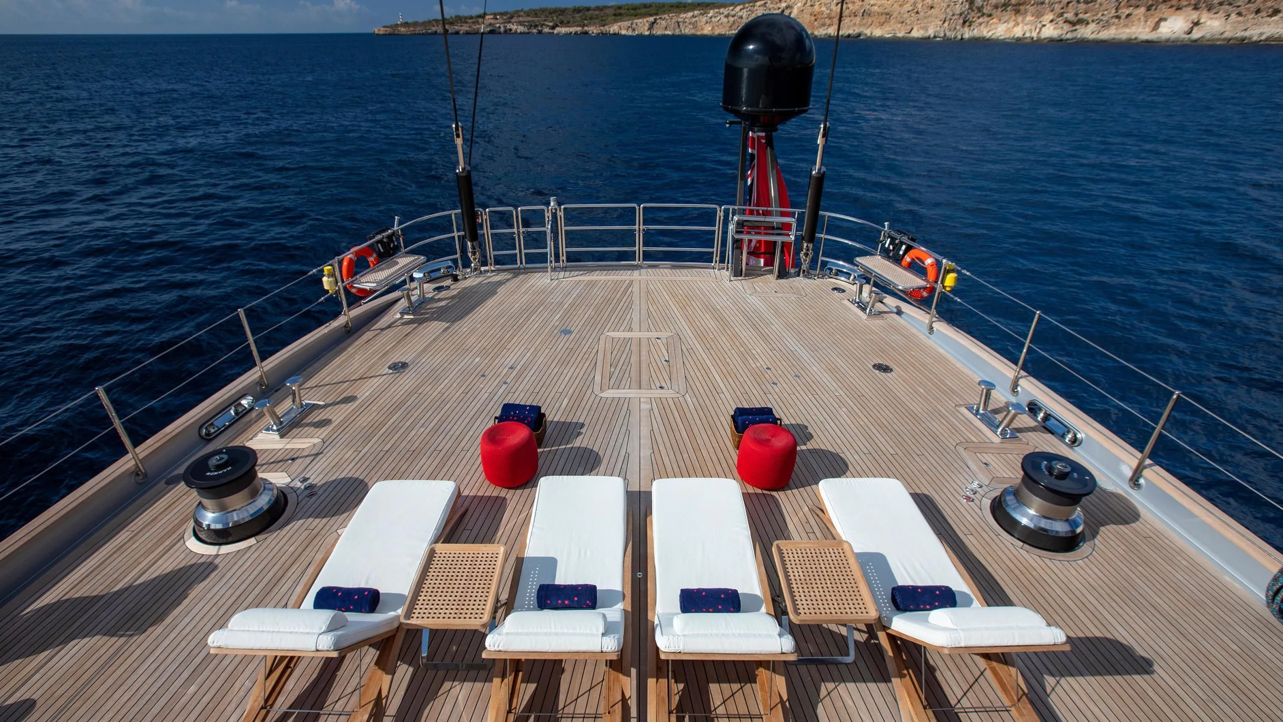a deck with a large boat on it and a red and white ladder on it aboard PERSEUS^3 Yacht for Sale