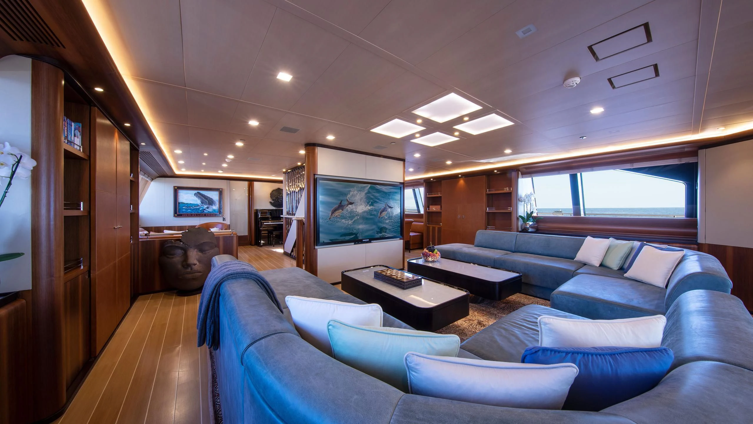a room with a couch and a television aboard PERSEUS^3 Yacht for Sale