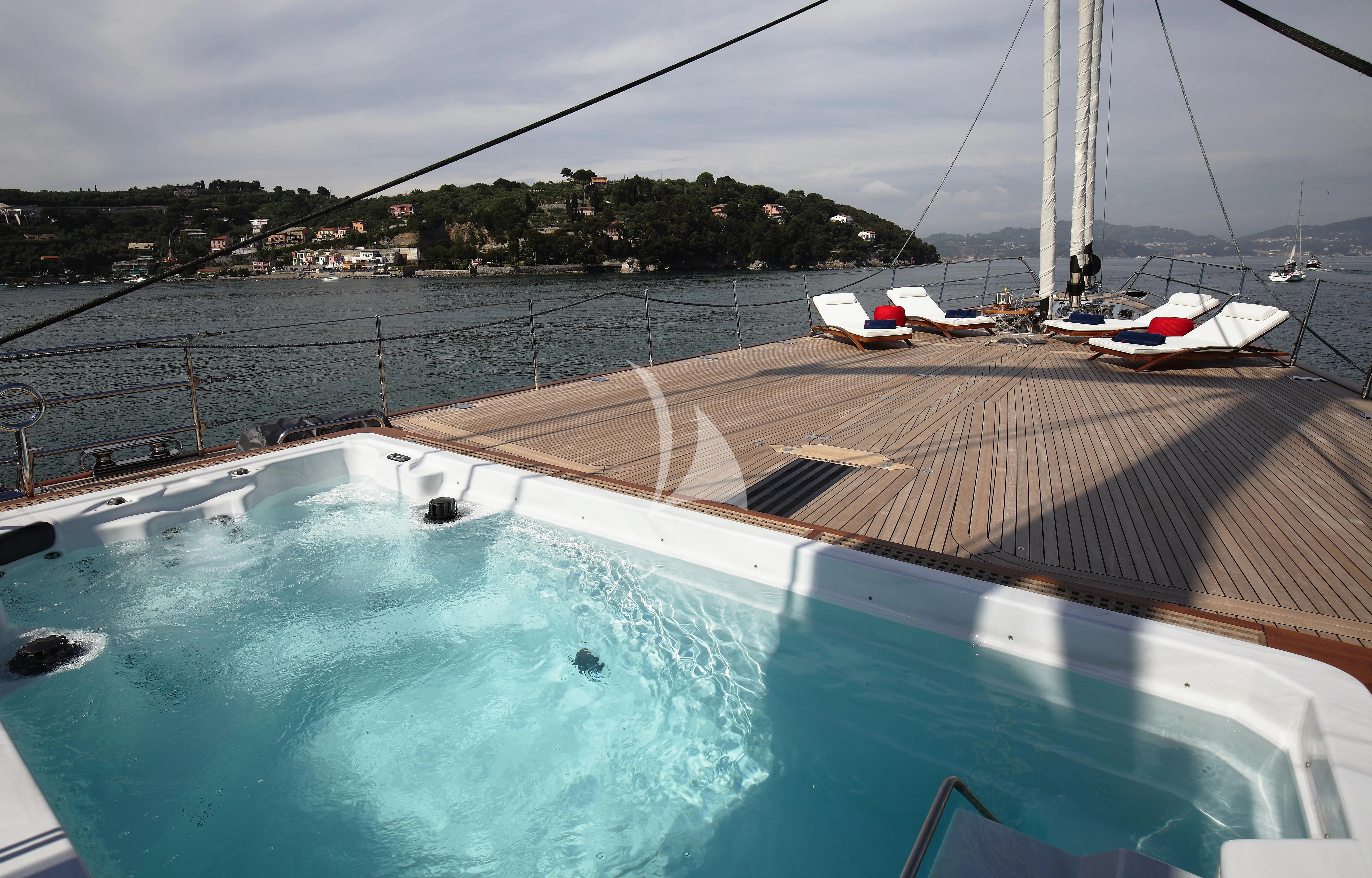 a swimming pool with boats on it aboard PERSEUS^3 Yacht for Sale