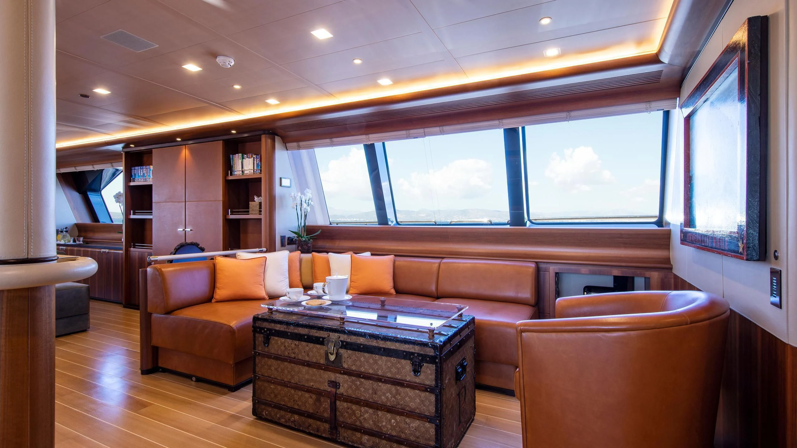 a living room with a wood floor aboard PERSEUS^3 Yacht for Sale