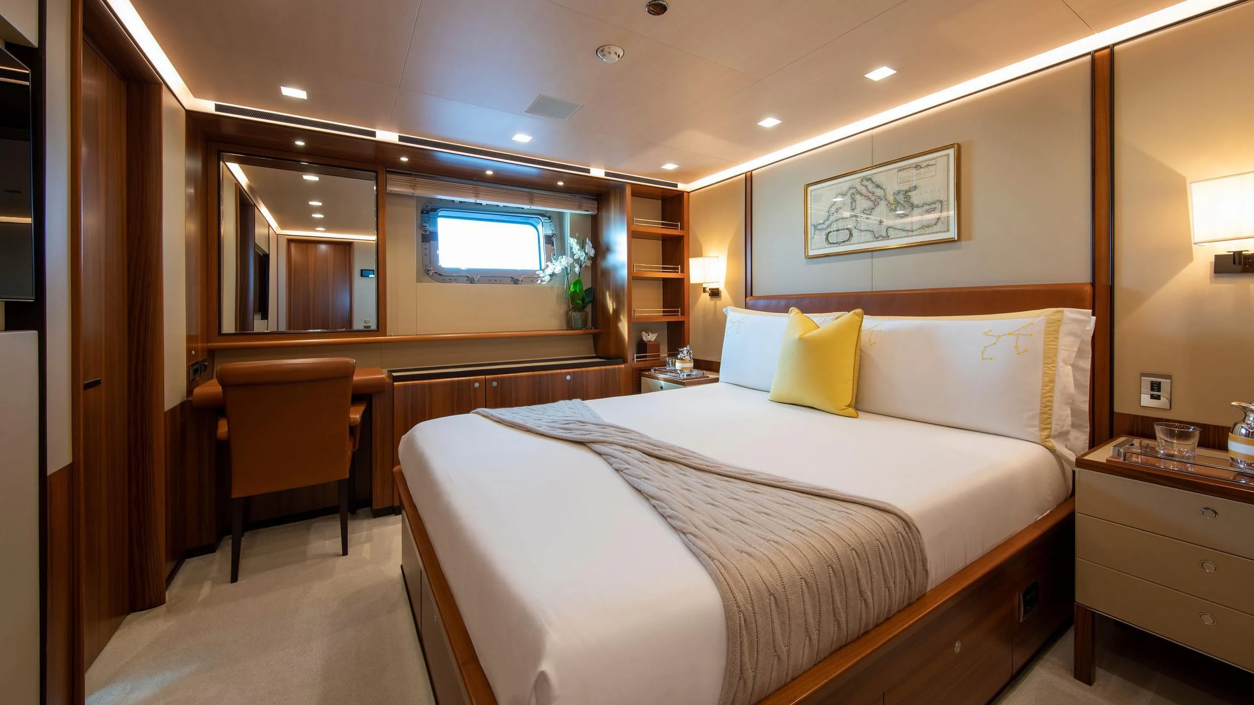 a hotel room with a bed and a desk aboard PERSEUS^3 Yacht for Sale