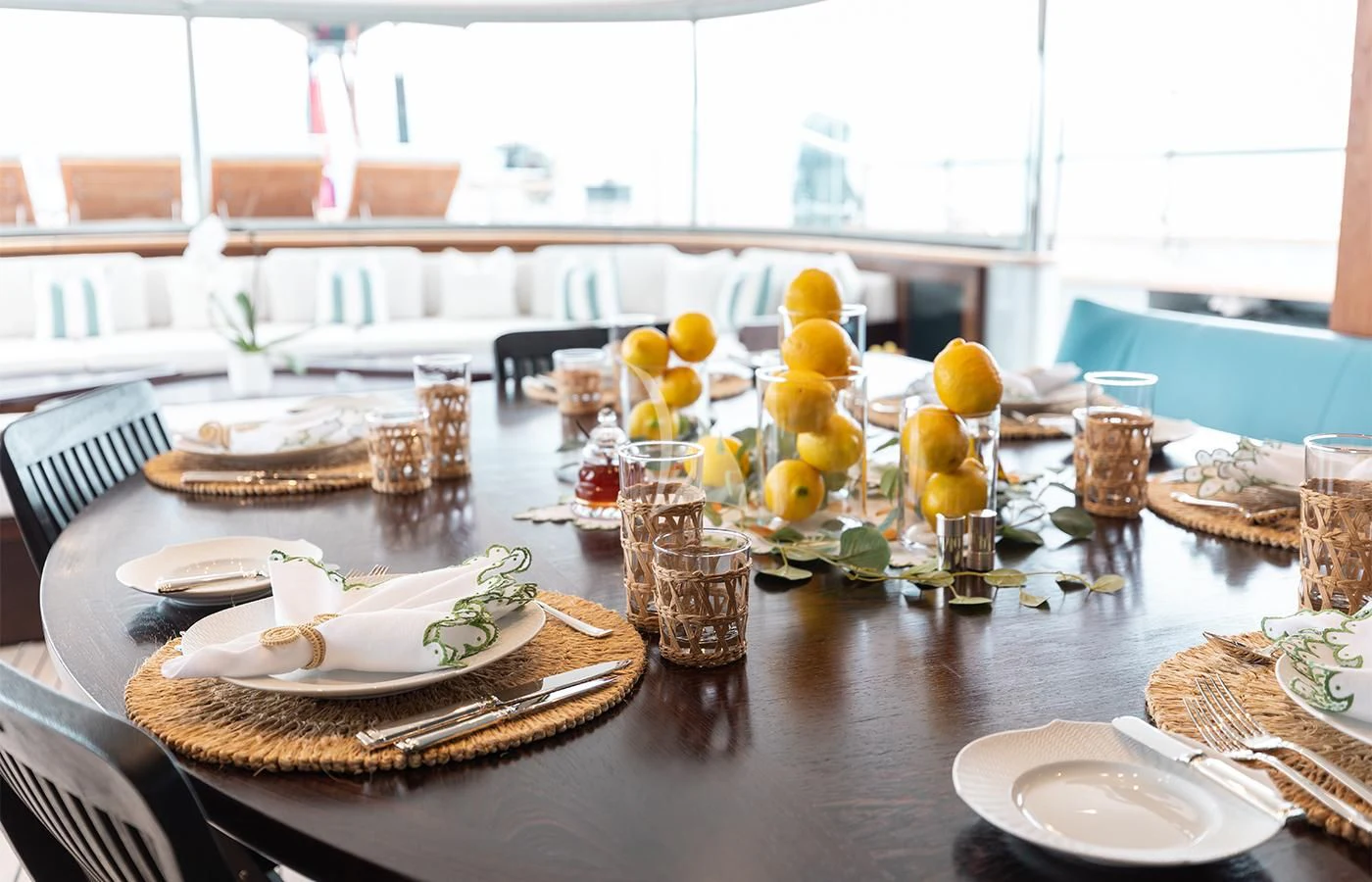 a table with plates and glasses aboard PERSEUS^3 Yacht for Sale