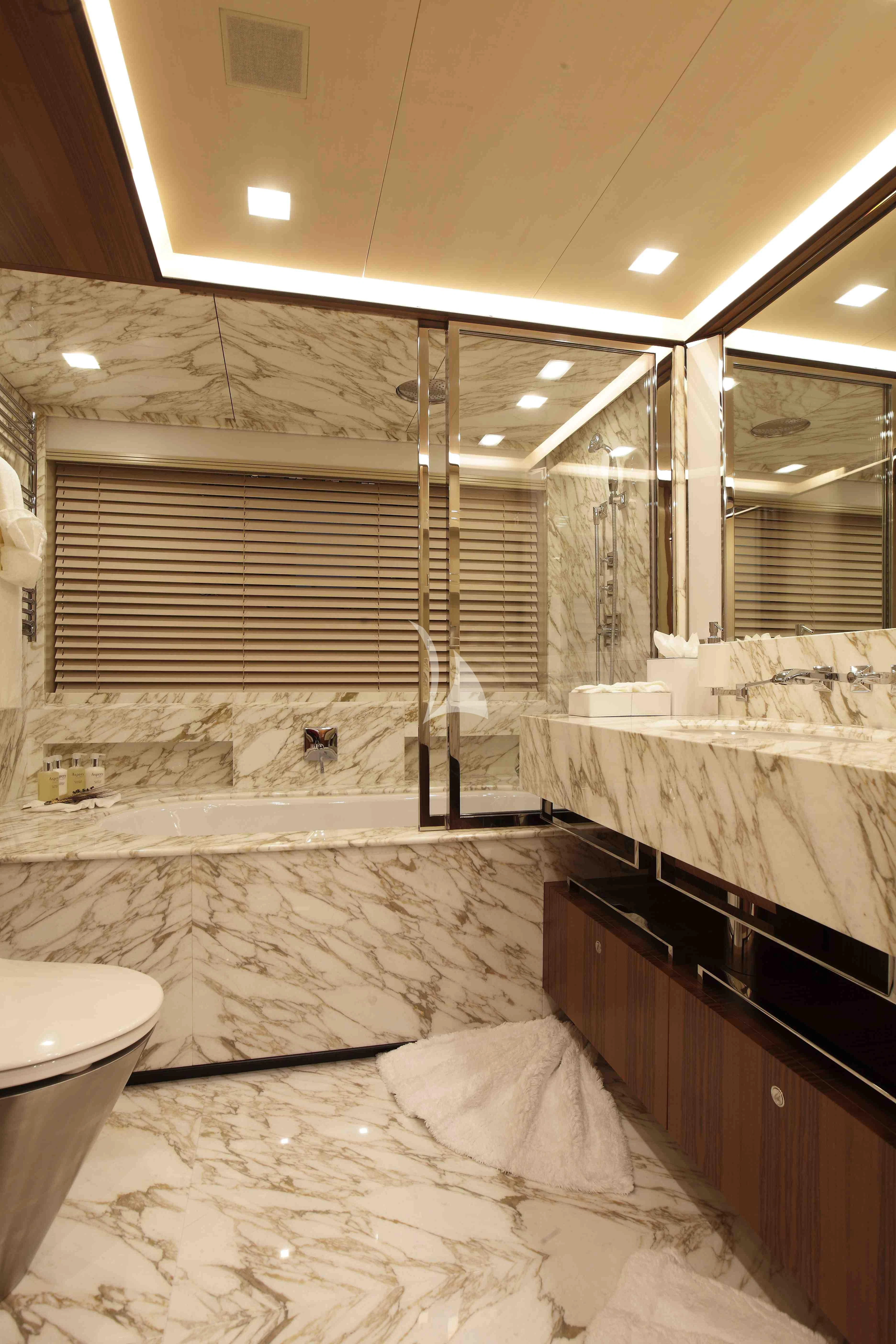 a bathroom with a tub sink and a shower unit aboard PERSEUS^3 Yacht for Sale