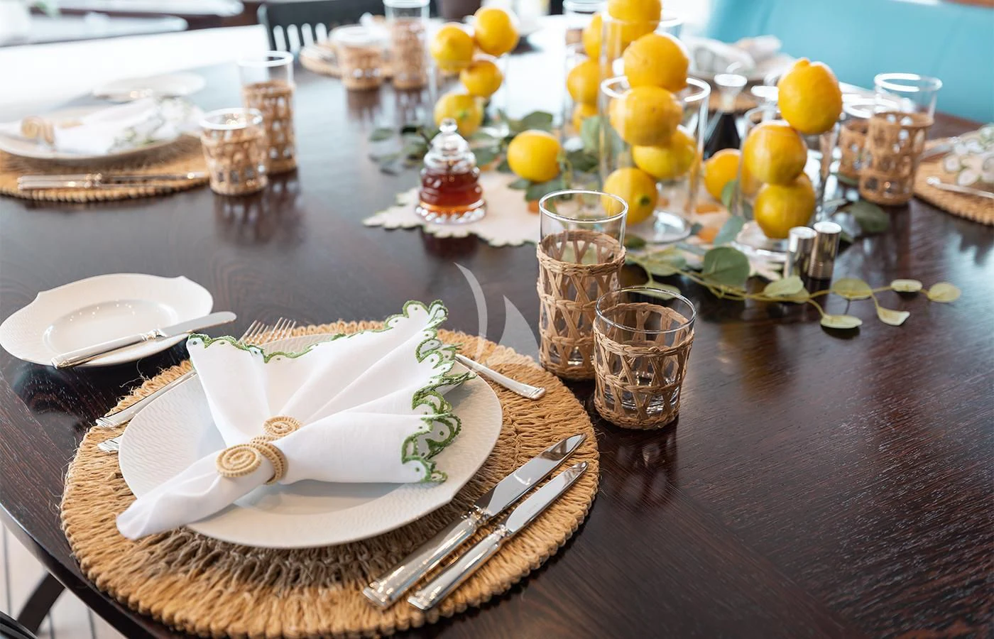 a table with plates and glasses aboard PERSEUS^3 Yacht for Sale