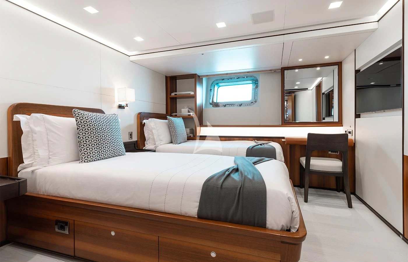 a bedroom with a bed and desk aboard PERSEUS^3 Yacht for Sale