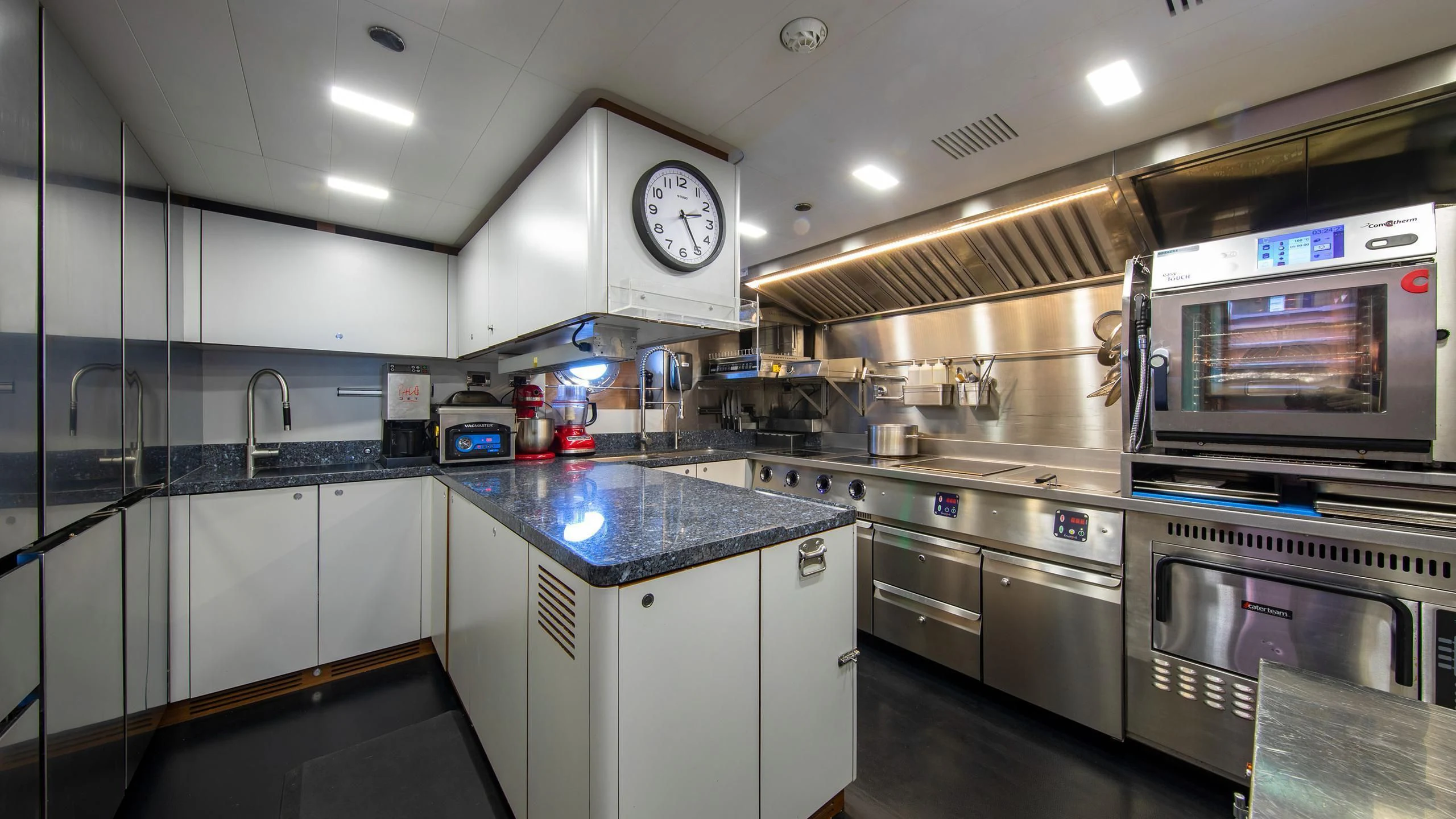 a kitchen with a large oven and microwave aboard PERSEUS^3 Yacht for Sale
