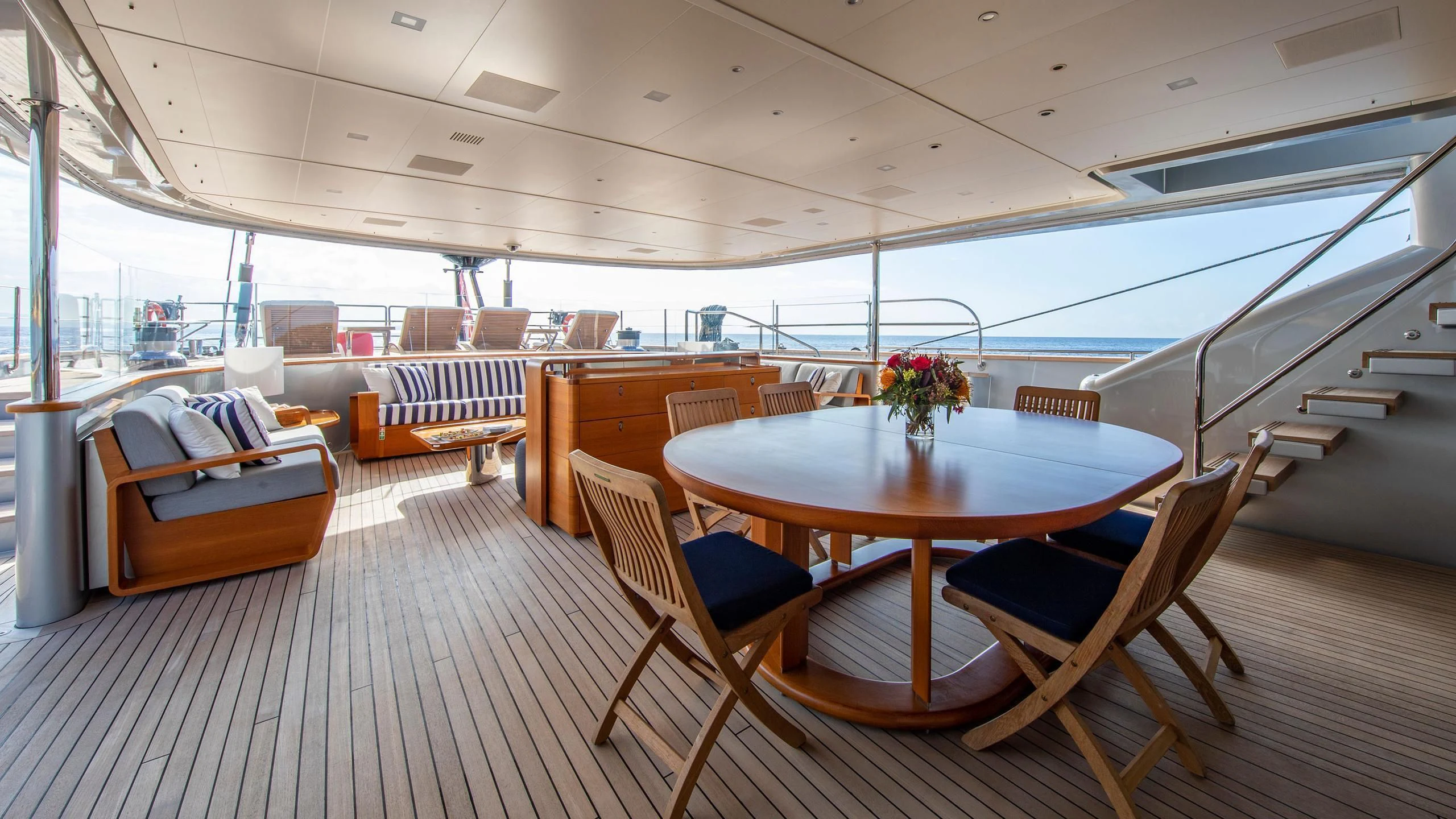 a boat with a table and chairs aboard PERSEUS^3 Yacht for Sale