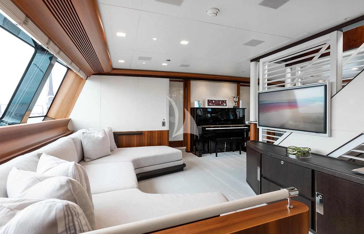 a living room with a large television aboard PERSEUS^3 Yacht for Sale