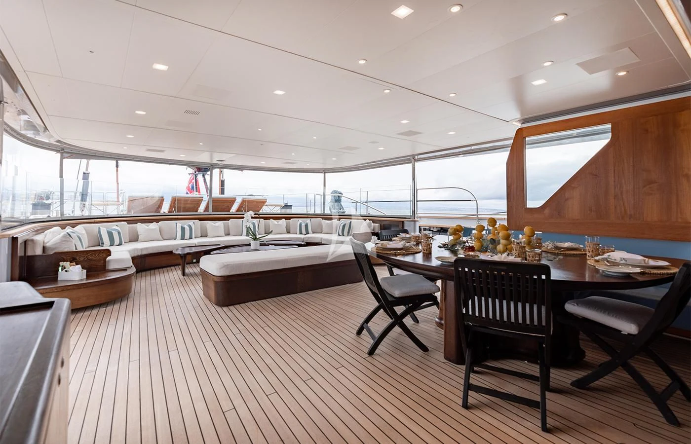 a large room with a table and chairs aboard PERSEUS^3 Yacht for Sale