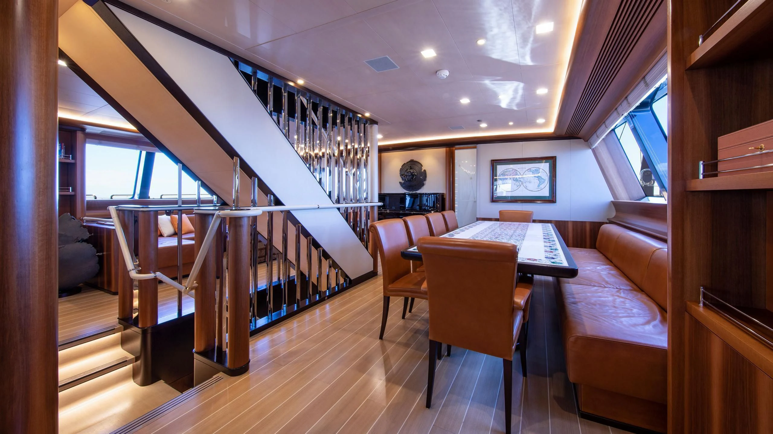 a room with a table and chairs aboard PERSEUS^3 Yacht for Sale