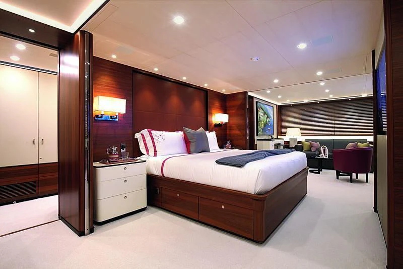 a large hotel room with a bed aboard PERSEUS^3 Yacht for Sale