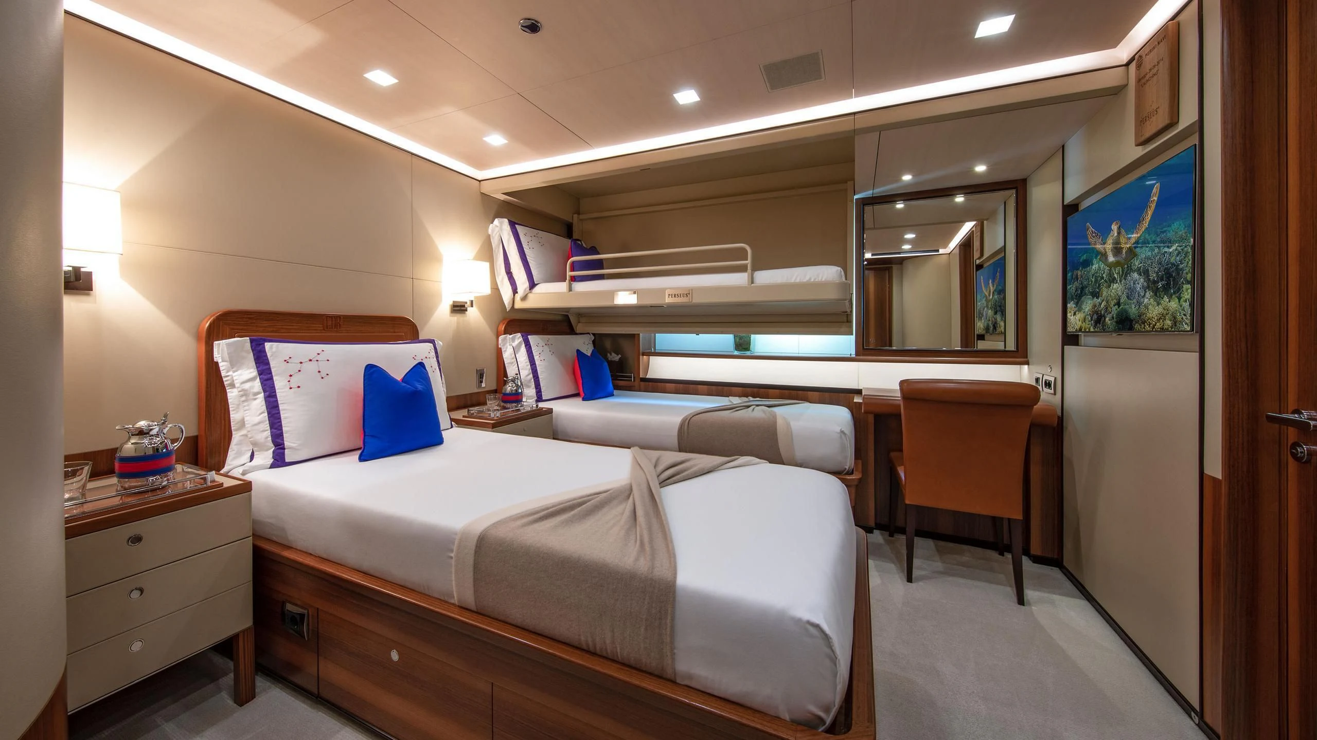 a hotel room with a bed and desk aboard PERSEUS^3 Yacht for Sale