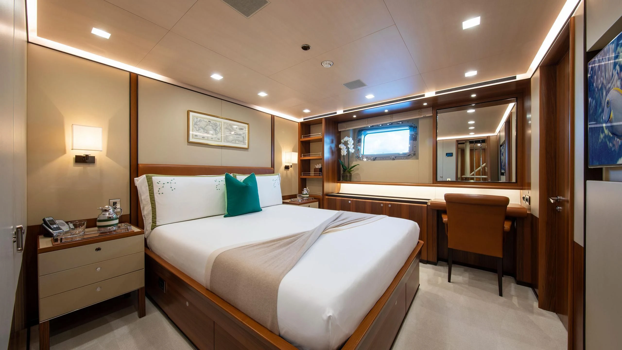 a hotel room with a bed and desk aboard PERSEUS^3 Yacht for Sale