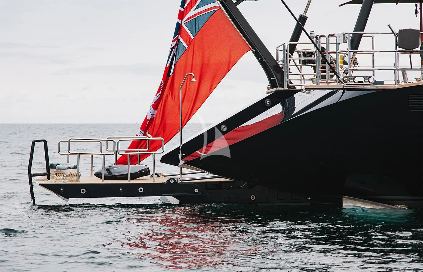 a black and red sailboat on the water aboard PERSEUS^3 Yacht for Sale