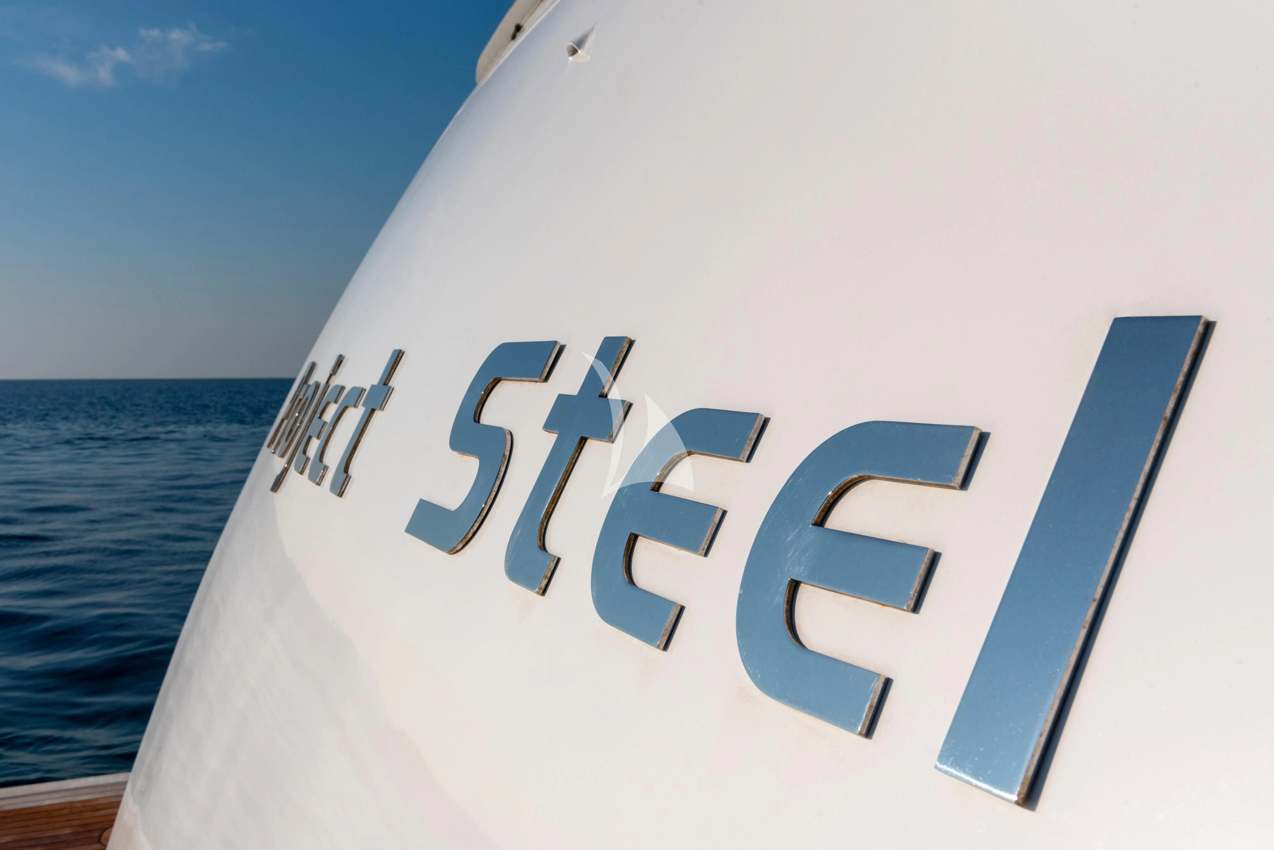 a white sign with a blue background aboard PROJECT STEEL Yacht for Sale