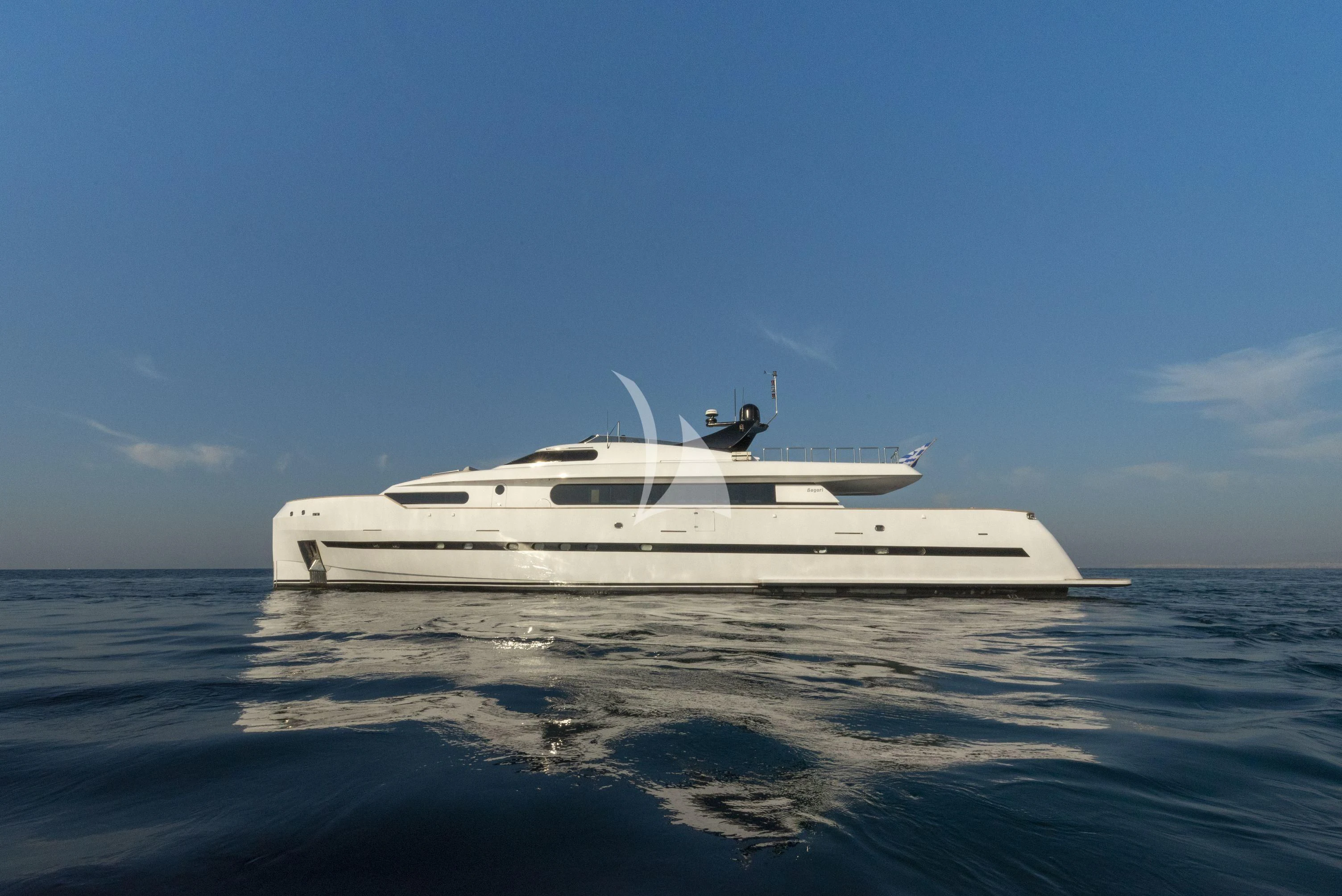 a white yacht on the water aboard PROJECT STEEL Yacht for Sale