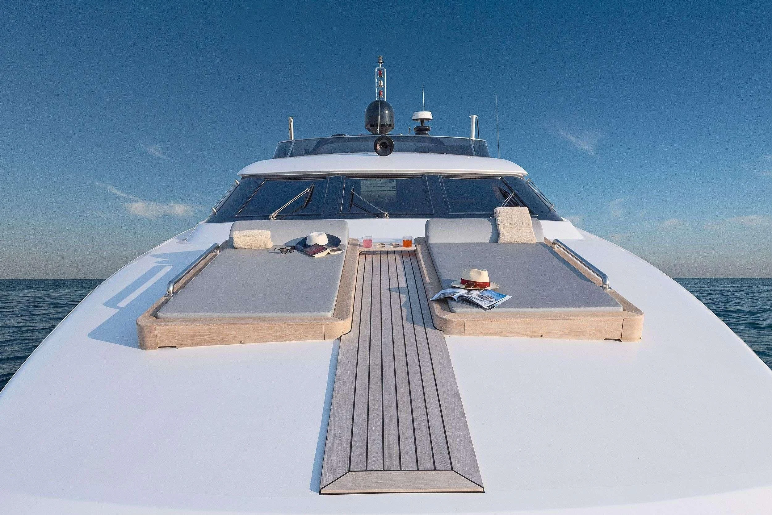 a white yacht on the water aboard PROJECT STEEL Yacht for Sale