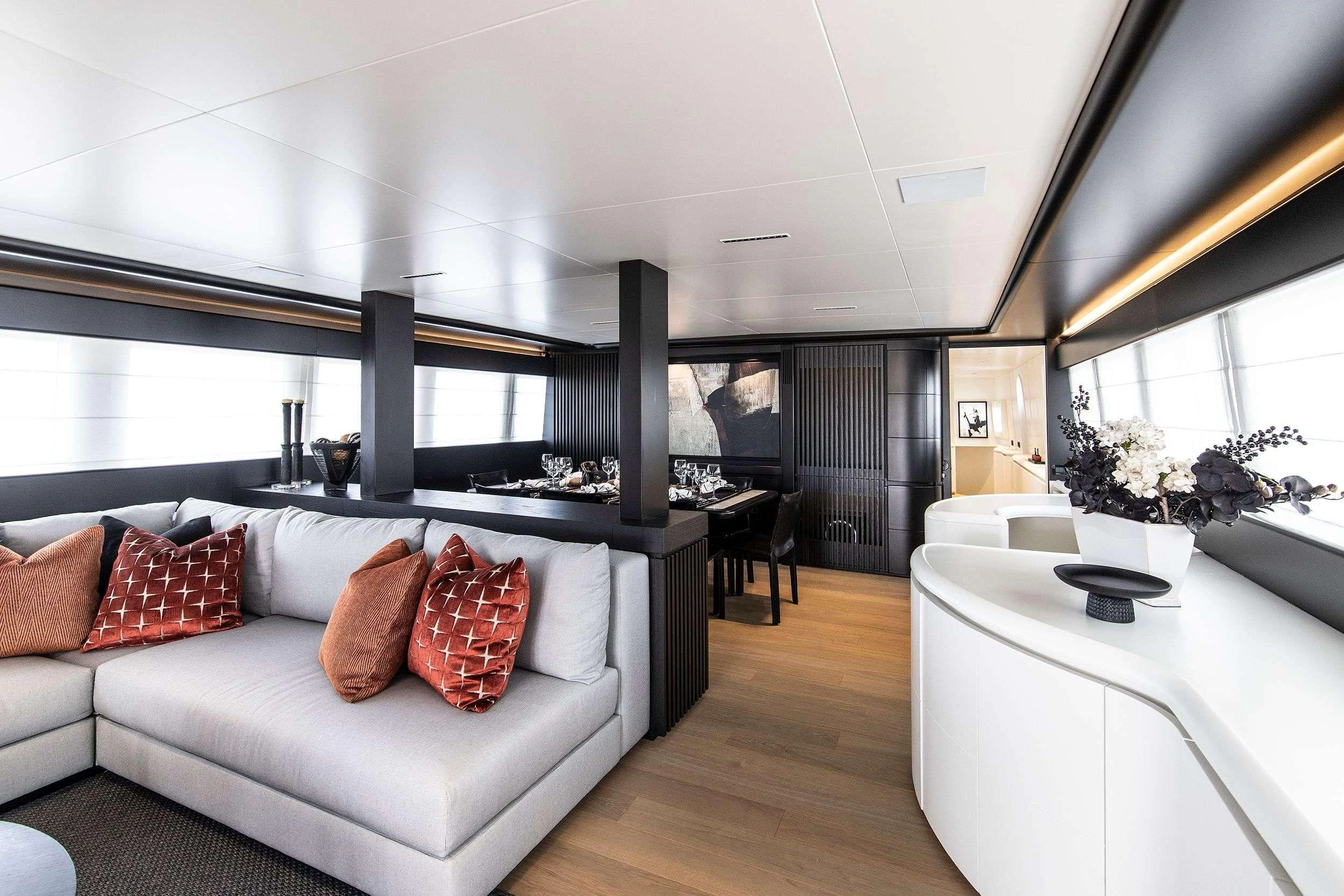 a living room with a large window aboard PROJECT STEEL Yacht for Sale