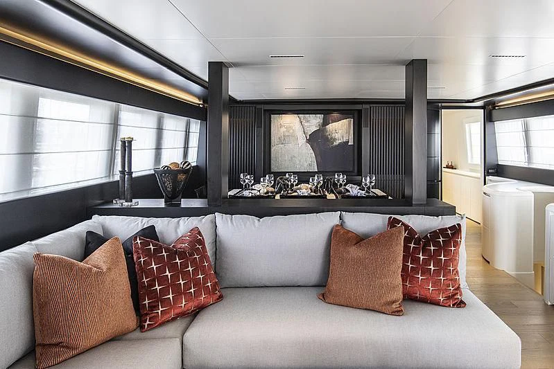 a large living room with a large window aboard PROJECT STEEL Yacht for Sale