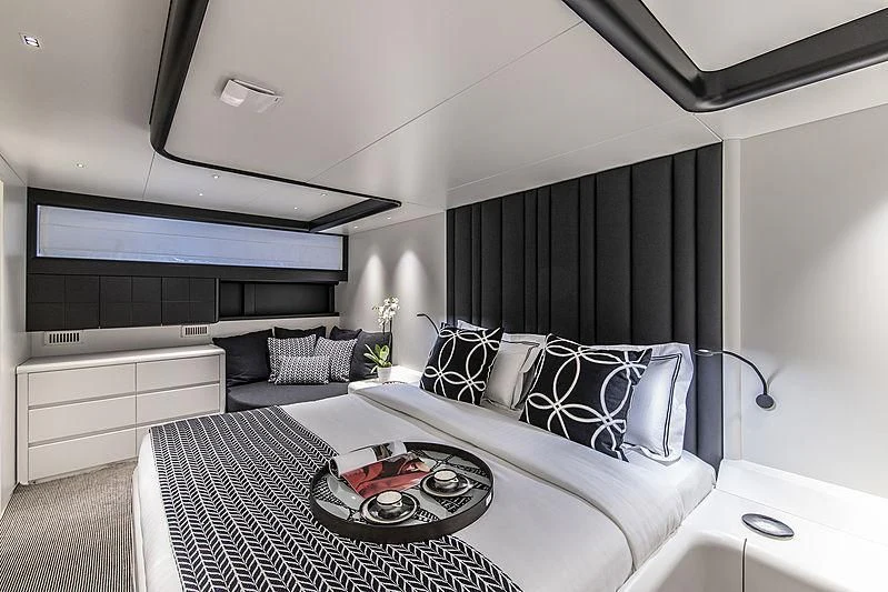 a living room with a black and white rug aboard PROJECT STEEL Yacht for Sale